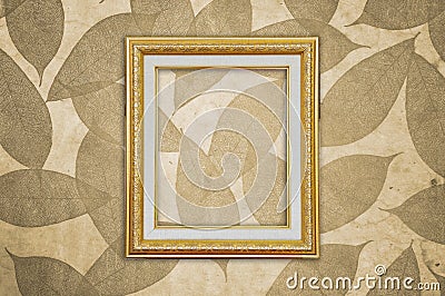 Gold Picture Frame on Brown Leaves Pattern Stock Photo