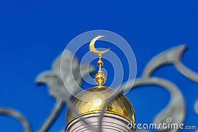 Gold-plated dome of a Muslim mosque Stock Photo