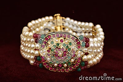 Gold plated jewelry - Fancy Designer golden and pearl `Jadau` Bracelet closeup macro image Stock Photo