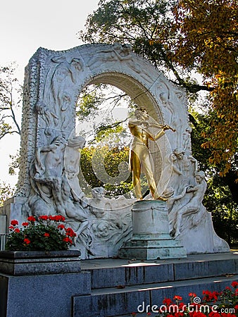 Gold-plated statue of Austrian composer Johann Strauss in stadtpark Editorial Stock Photo