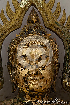 Gold plates on face buddha,The Buddha statue to gild with gold l Stock Photo