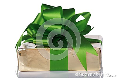 Gold present wrapped with green ribbons Stock Photo