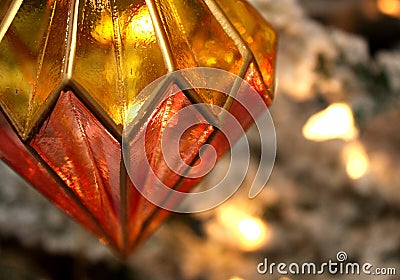 Gold and Red Illuminated Stained Glass Christmas Ornament Stock Photo
