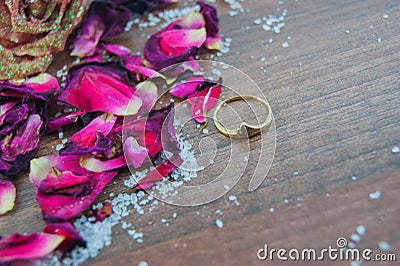 Gold ring, rose petals, rose Stock Photo