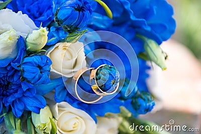Gold rings and a festive wedding bouquet Stock Photo