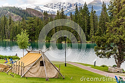 Gold Rush Accommodation tent with Mountain and Lake Editorial Stock Photo