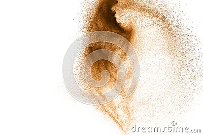 Gold sand splash against on clear background. Sandy fly wave in the air Stock Photo