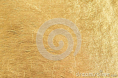 Gold shiny foil background, yellow gloss metallic texture Stock Photo