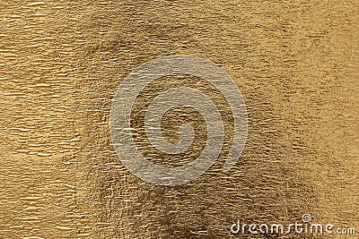 Gold shiny foil background, yellow gloss metallic texture Stock Photo