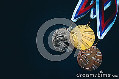 Gold, silver and Bronze medal, sport trophy photo, black background Stock Photo