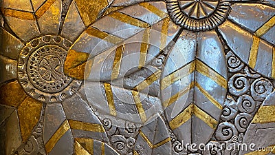 Gold and silver floral design on a wall Editorial Stock Photo