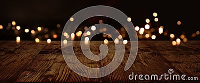 Gold and silver lights on dark wood Stock Photo