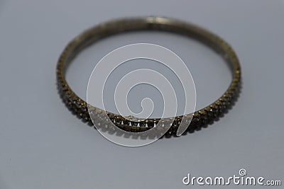 Gold,silver new design bangles jewellery on black blur background. Stock Photo