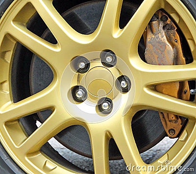 Gold sportscar racing wheel Stock Photo