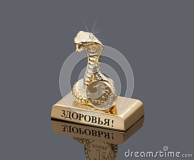 Gold statuette in the form of a snake. Editorial Stock Photo