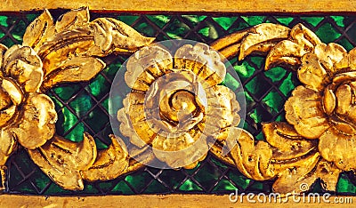 The gold stucco design of native thai style on the Wall Stock Photo