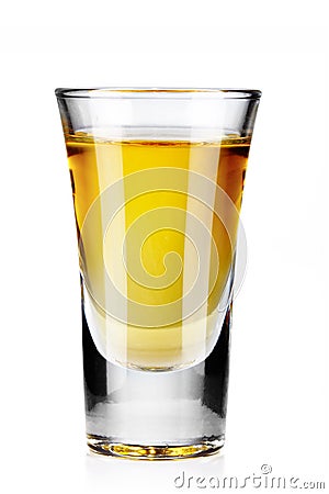 Gold tequila shot isolated on white Stock Photo