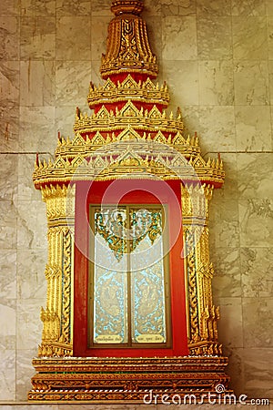 Gold Thai pattern carving Kanok picture in temple Stock Photo