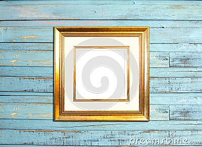 Gold Vintage picture frame on blue wood background Stock Photo