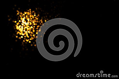 Golden abstract bokeh on black background. Stock Photo