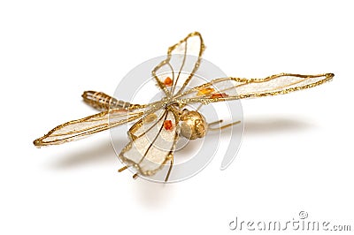 Golden accessory in form dragonfly Stock Photo