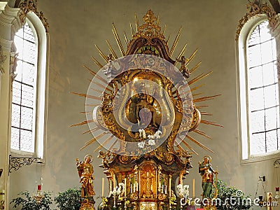 Golden altar with rays of pilgrimage church ornamental Stock Photo