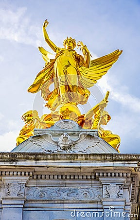 Golden angel sculpture on top of Victoria Memorial in front of Buckingham Palace, London, UK Editorial Stock Photo