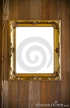 Golden antique frame on wood background Stock Photo