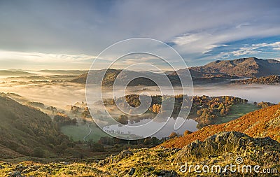 Golden Autumn sunrise in a valley of the Lake District Stock Photo