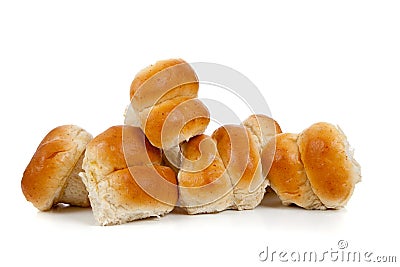 Golden baked dinner rolls on a white background Stock Photo