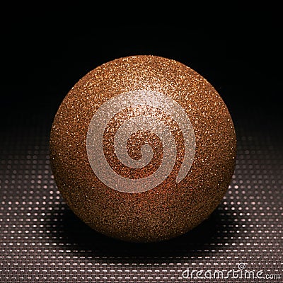 Golden ball.Black background.Sphere.Shadow.Still-life Stock Photo