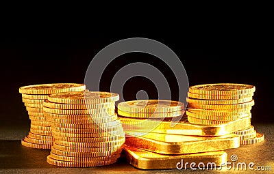 Golden bars and coins Stock Photo