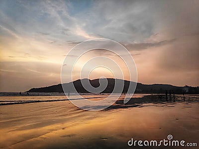 Golden beach Sunset waves Stock Photo