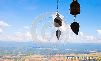 A golden bell hanging from the back of the sky and beautiful nat Stock Photo