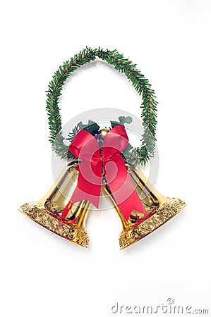 Golden bells with a red bow on white. Stock Photo