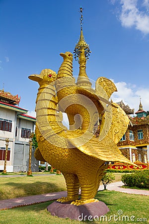 Golden bird statue in Wat Thai Wat Tha Na Ram temple in Mae sot, Tak, Thailand Stock Photo