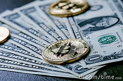 Golden bitcoin coins on a paper dollars money and dark background with sun. Virtual currency. Crypto currency. New virtual money Stock Photo