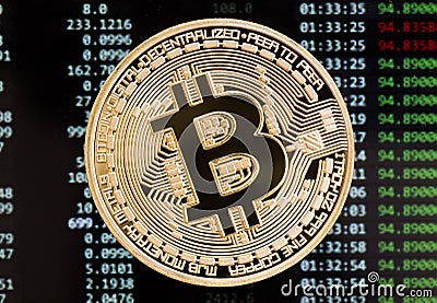 Golden bitcoin cryptocurrency coin on a circuit board background Stock Photo