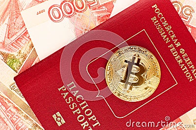 Golden bitcoin on russian passport Stock Photo