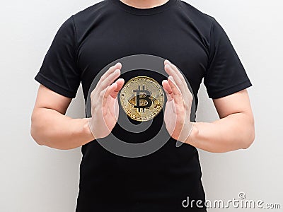 Golden bitcoin at space of man hand middle body on white isolated background Stock Photo
