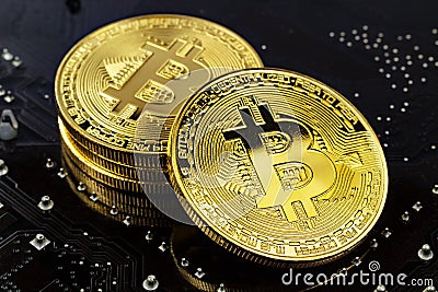 Golden bitcoins on the black background closeup. Cryptocurrency virtual money Stock Photo