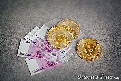 Golden Bitcoin on gray background, cryptocurrency concept Stock Photo