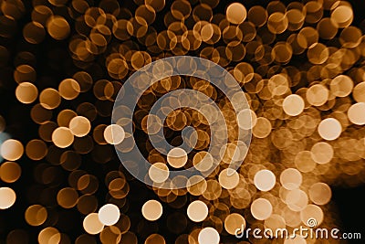Golden bokeh lights blurred background Stock Photo