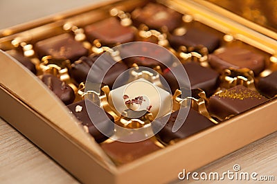 Golden Box of Fine Belgian Chocolates in Different Colors and Kinds Stock Photo