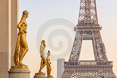 Golden bronze statues on Trocadero square, Eiffel tower, Paris France Stock Photo