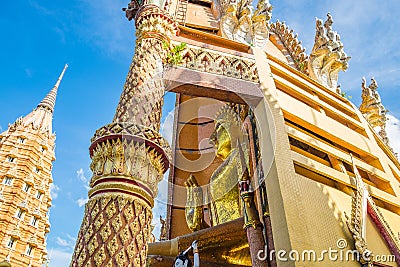 Golden buddha beside in church at wat tham sua Stock Photo