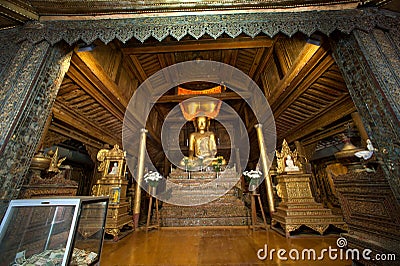 Golden Buddha inside at wood Church of Nyan Shwe Kgua temple. Stock Photo