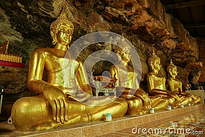 Golden buddha sculpture in cave Editorial Stock Photo