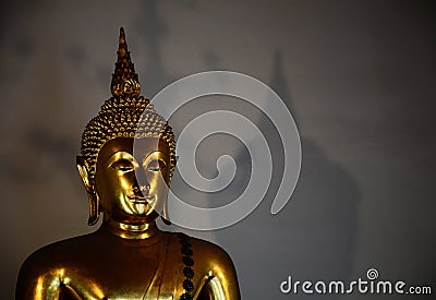 Golden buddha with shadow Editorial Stock Photo