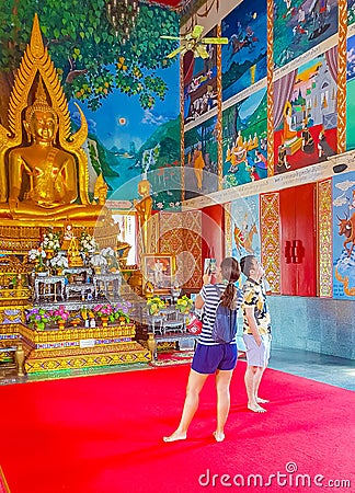Golden buddha statue art paintings Wat Plai Laem temple Thailand Editorial Stock Photo